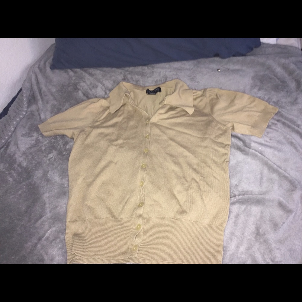 A cream colored button up shirt, super aesthetic.